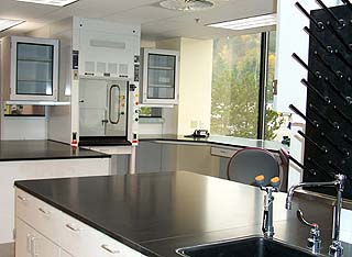 The crime lab hosts six evidence examination rooms, 3,500 square feet of evidence storage space, office space for 80 staff members, and laboratory space for 56 scientists.